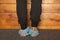 Girl in protective medical shoe covers stands on the floor in the hospital