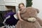 Girl in purple dress at christmas with a huge bear