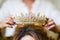 Girl puts crown jewelry on the bride s head