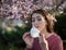 Girl putting facial mask on for pollen allergy protection