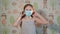 Girl putting on a medical mask