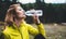 Girl quenches thirst after fitness, person drinking water from plastic bottles relax after exercising sport outdoors, woman isolat