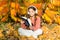 Girl read book on autumn day. Autumn literature concept. Child enjoy reading. Studying twice faster using visual and