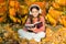 Girl read book on autumn day. Little child enjoy learning in autumn park. Kid study with book. Autumn literature concept