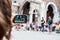 Girl realizes video clip with her smartphone during street performances at the busker festival in Ferrara