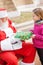 Girl Receiving Present From Santa Claus