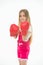 Girl in red boxing gloves, training strong spirit. Kid in pink jump suit isolated on white background. Child with