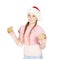Girl in red christmas hat holds gingerbread cookies in hand on w