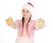 Girl in red christmas hat holds gingerbread cookies in hand on w