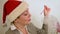 Girl in red Christmas Santa hat blows bubbles fun