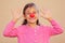 Girl with red clown nose smiles