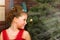 Girl in red dress welcomes New year and Christmas