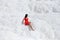Girl in red dress on white travertines, Pamukkale