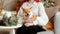 A girl with red hair hugs a cute dog Shiba Inu, lying on her lap, in a room decorated in new year`s style . Trust