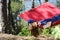 Girl in red hammock, woods