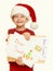 Girl in red hat with letter to santa - winter holiday christmas concept, yellow toned
