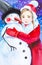 A girl in a red hat and a red coat hugs a snowman in the Christmas forest. Festive watercolor illustration
