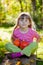 Girl with red kuri squash