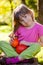 Girl with red kuri squash