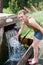 Girl Refilling a Water Jug