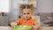 Girl refusing eat breakfast oatmeal, pushing bowl away, healthy child nutrition