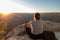 The girl relaxes at sunset over the Grand Canyon in the USA