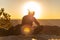 The girl relaxes at sunset over the Grand Canyon in the USA