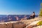 The girl relaxes at sunset over the Grand Canyon in the USA