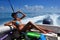 Girl relaxing on the back of motor boat