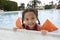 Girl Relaxing On Edge Of Swimming Pool