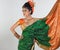 Girl in rich silk green sari