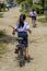 Girl ridding a bicycle in her way to the school