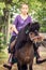 Girl ridding on a horse