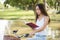 girl ride bike and read book in park