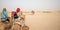 A girl ride on camel in the Sahara desert, Tunisia, Africa