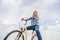 Girl rides bicycle sky background. Most satisfying form of self transportation. Carefree and satisfied. Woman feels free