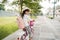 Girl riding a bicycle in the park going to school by herself