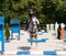 Girl riding roan pony on showjumping competition