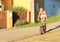 Girl riding and standing on a bike