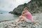 Girl on rocky beach