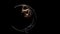 Girl rotating design in the form of a moon. Black background. Slow motion