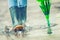 Girl in rubber boots outdoors in rainy day