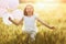 Girl running on cereal field