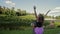 A girl with a running jump on his hands to his boyfriend and he turns around. The girl spread her hands to the sky. Very nice shot