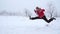 Girl running and jumping on winter landscape, slow motion