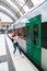 Girl runs on platform to door of departing train