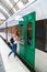 Girl runs on platform to door of departing train