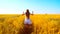 Girl runs with wheat across the field