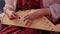 Girl in Russian folk costume playing vintage musical instrument - the gusli