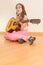 Girl with russian seven-string acoustic guitar